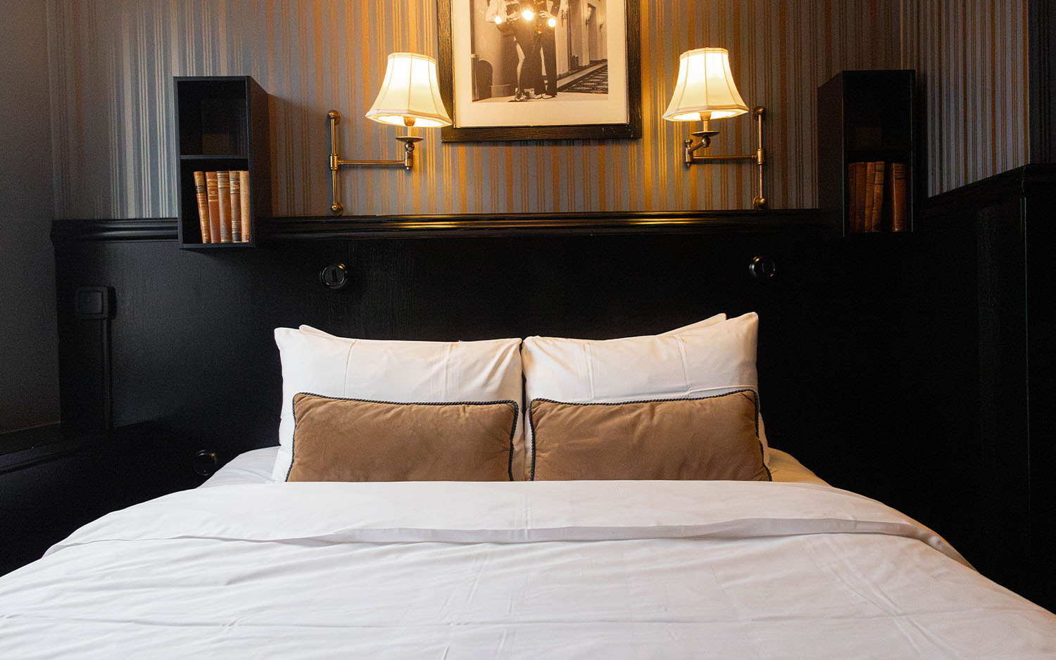 Bellora hotel room with full bed and elegant furnishings