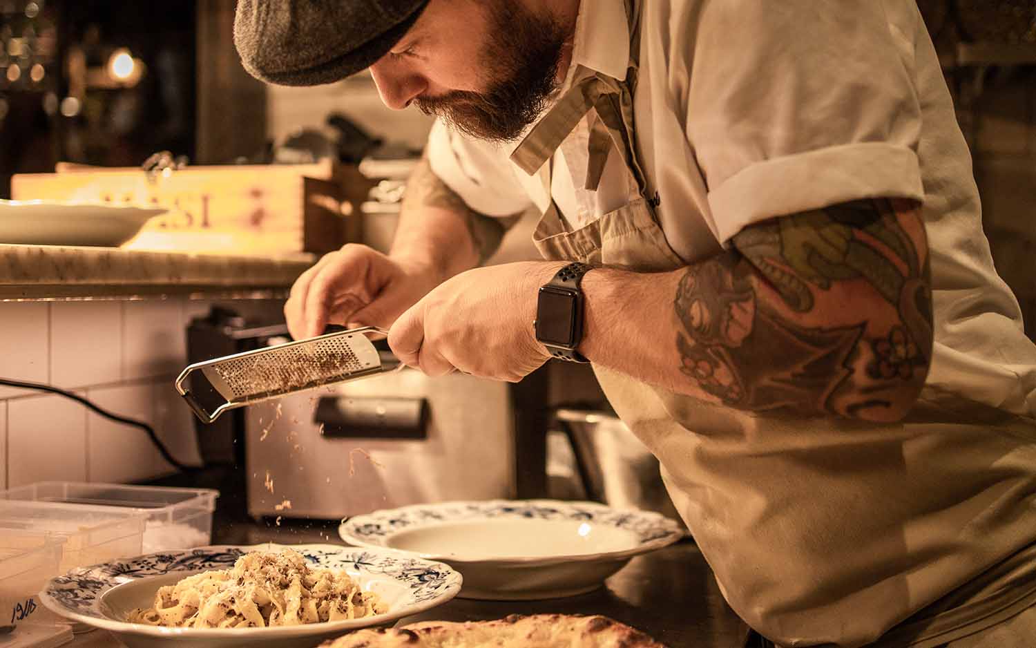 Upstairs dining area with intimate table setting at Hotel Bellora