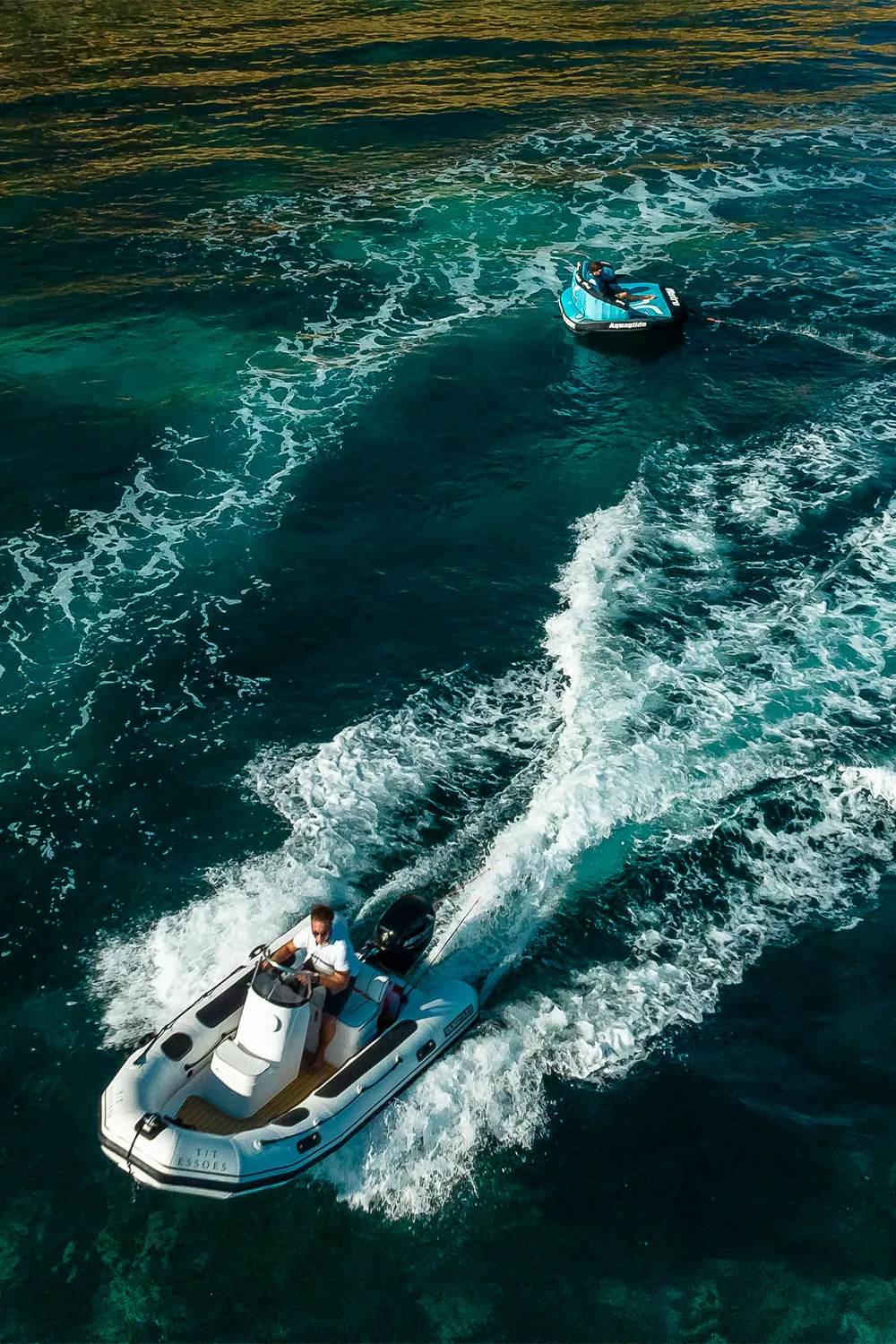 Experienced skipper navigating the ESSOESS tender near Palma