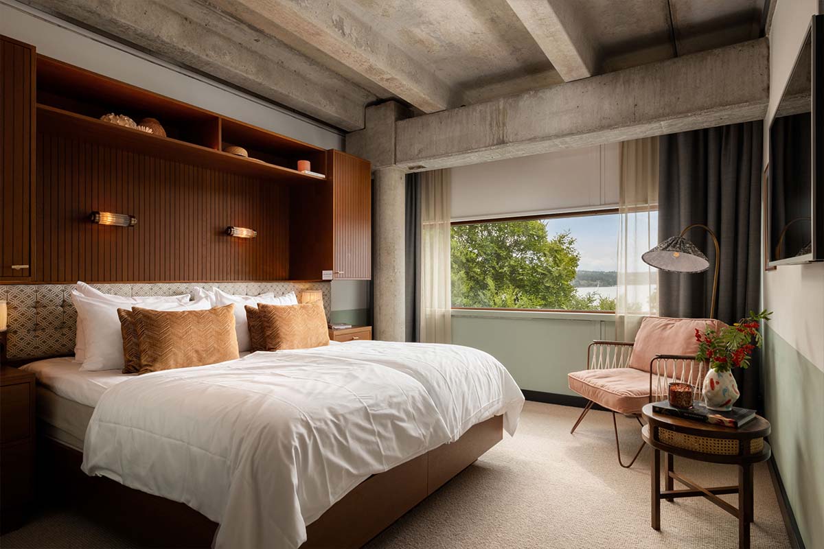 Ellery Beach House hotel room with modern furnishings and natural light