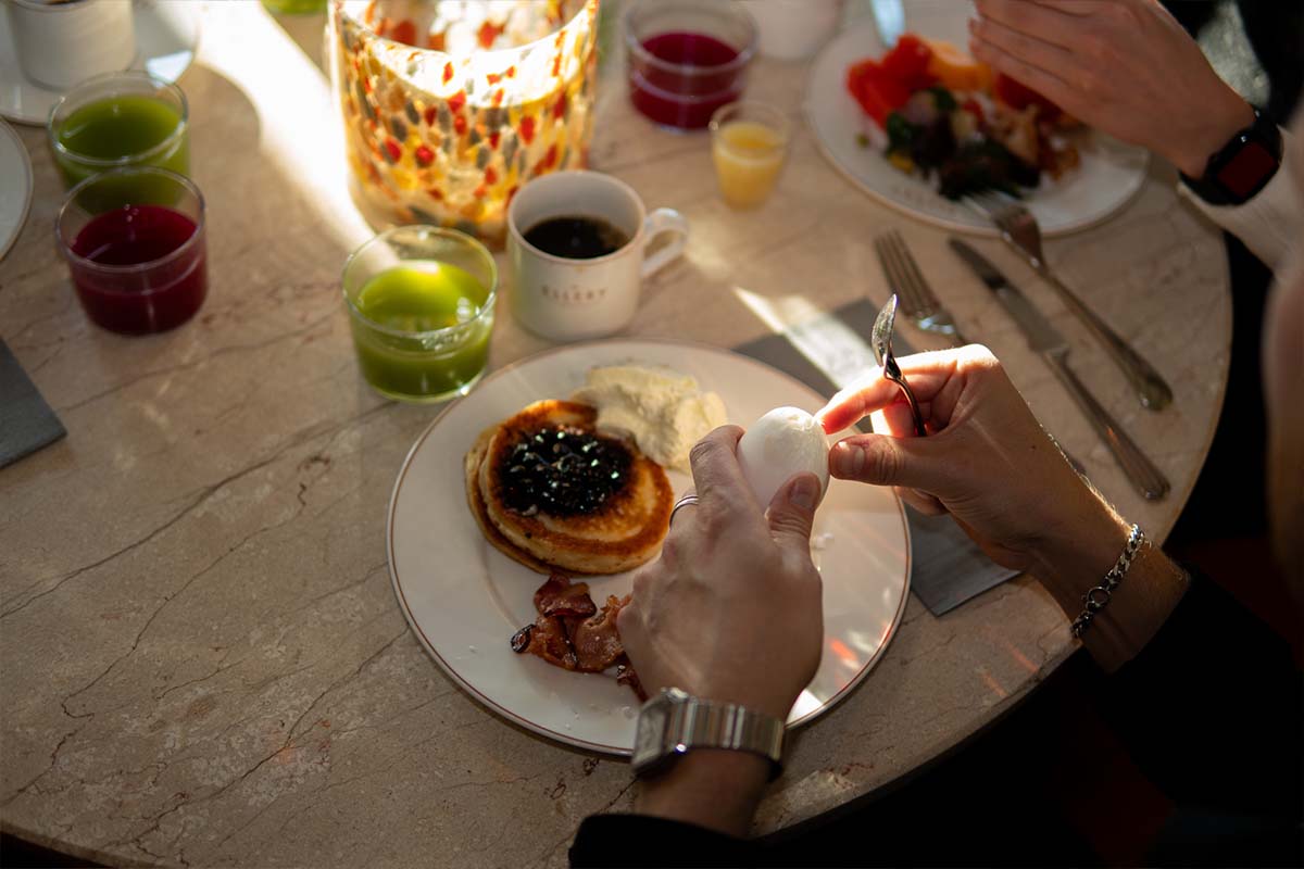 Breakfast spread at Ellery Beach House with fresh pastries and fruit