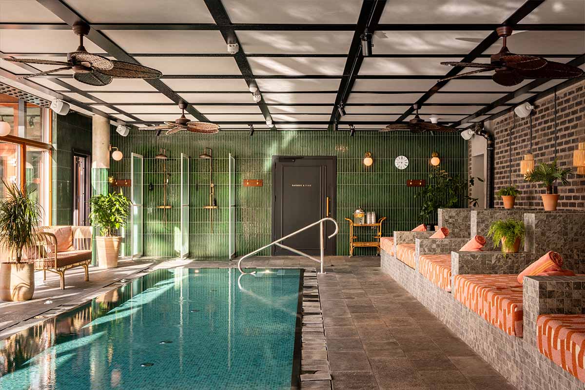 Ellery Beach House pool area with turquoise water and sun loungers