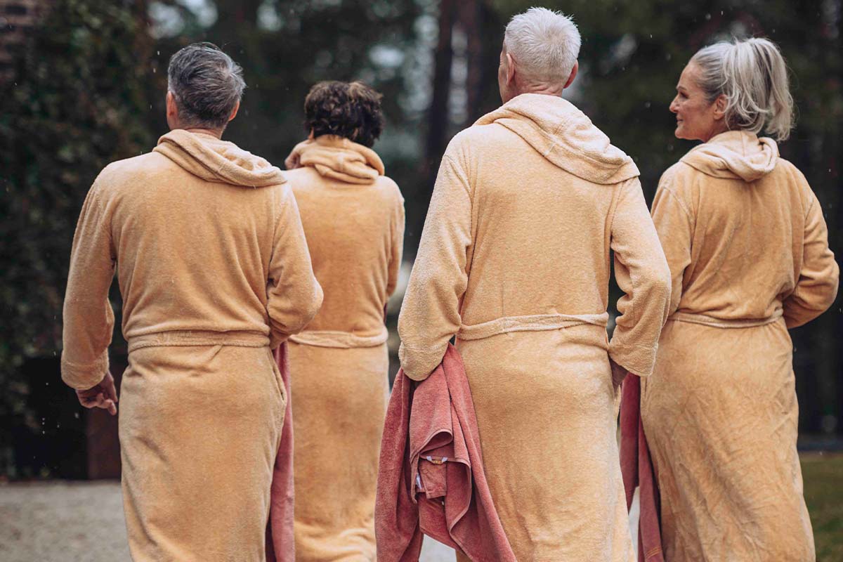 Guests in bathrobes relaxing at Ellery Beach House spa retreat