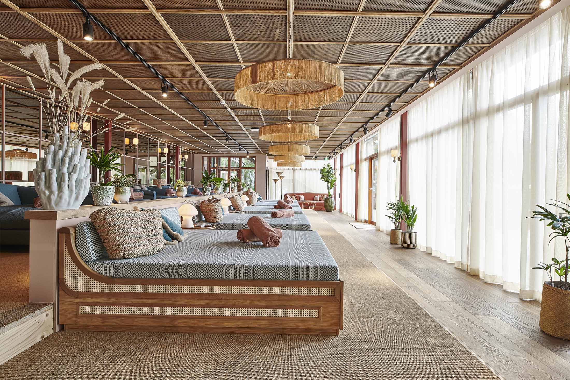 Ellery Beach House garden terrace with outdoor furniture and sea breeze