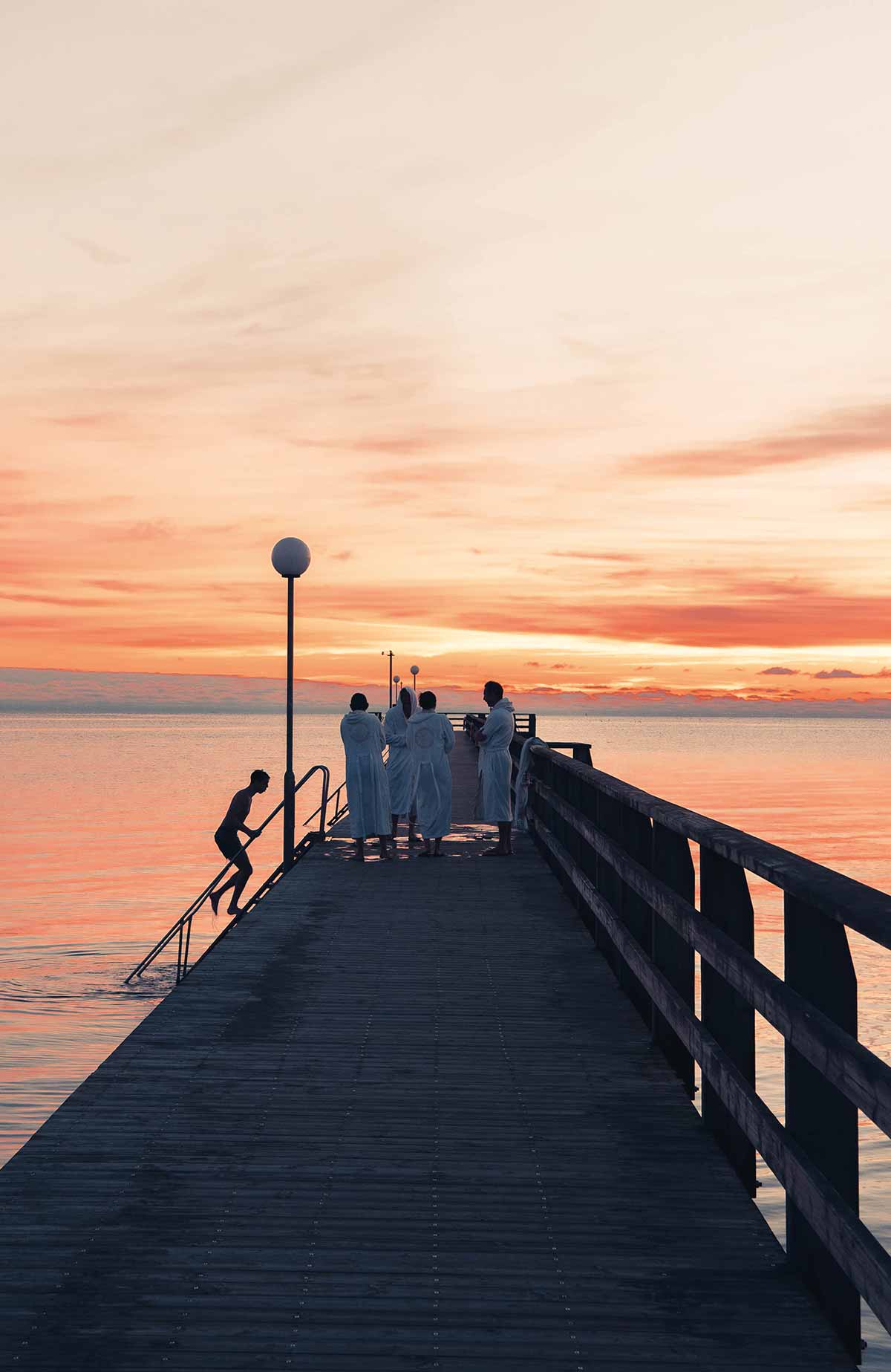 Sandy beach and ocean waves outside Falkenberg Strandbad conference resort