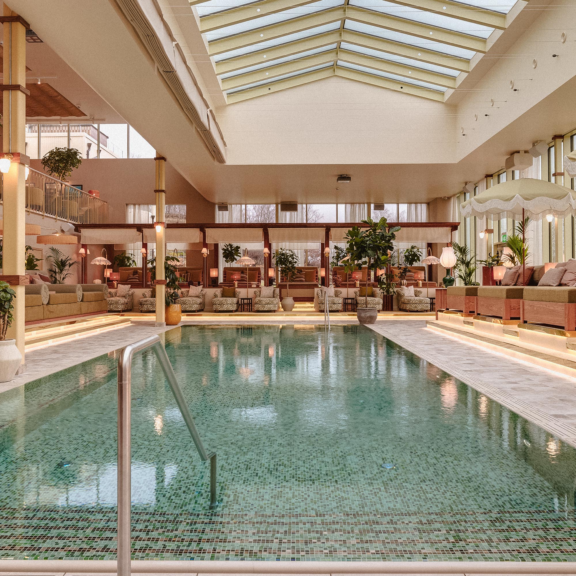 BayBay Pool Club guests relaxing by the heated pool at Hjortviken