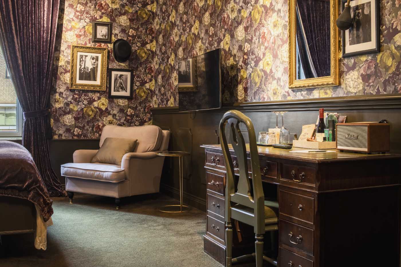 Art-filled hallway with cultural accents at Hotel Pigalle