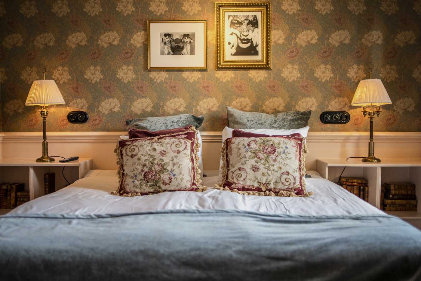 Boutique corridor with gallery-style artwork at Hotel Pigalle