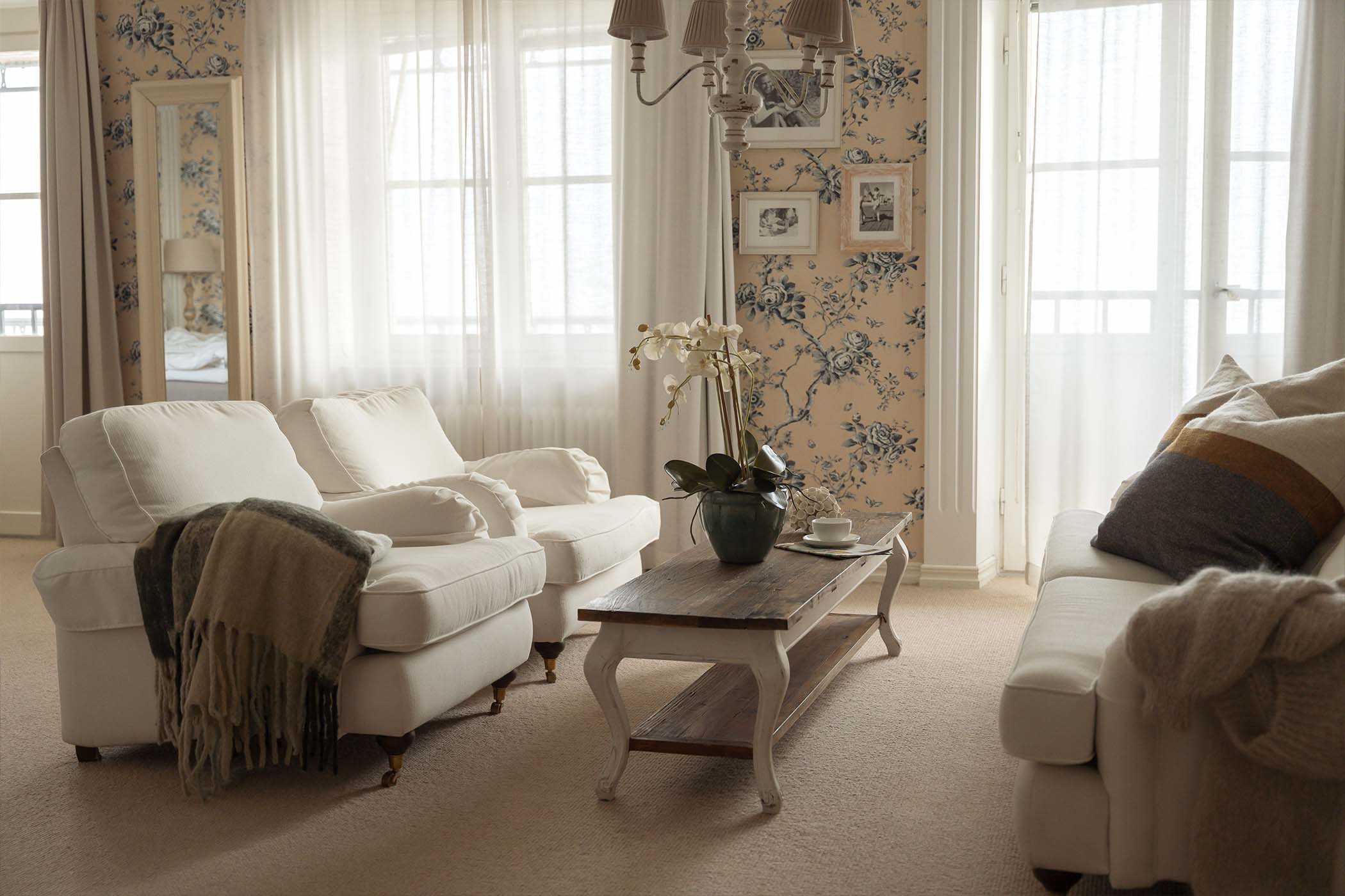 Hotel room lounge area with sea views at Ystad Saltsjobad