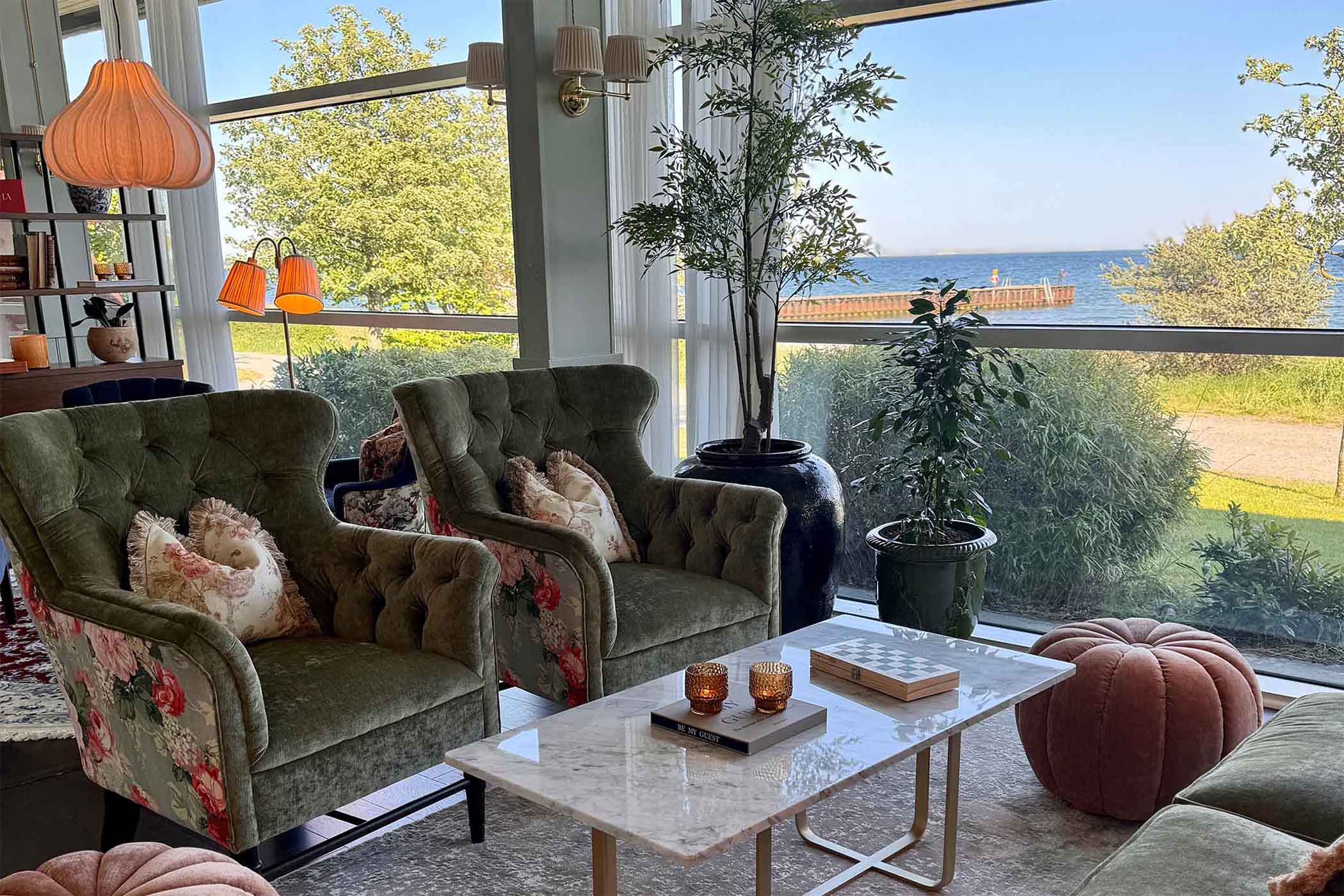 Lounge sofas with panoramic sea views at Ystad Saltsjobad